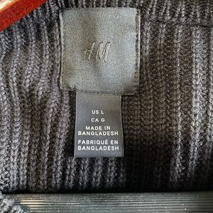This is a knitted Black sweater size L